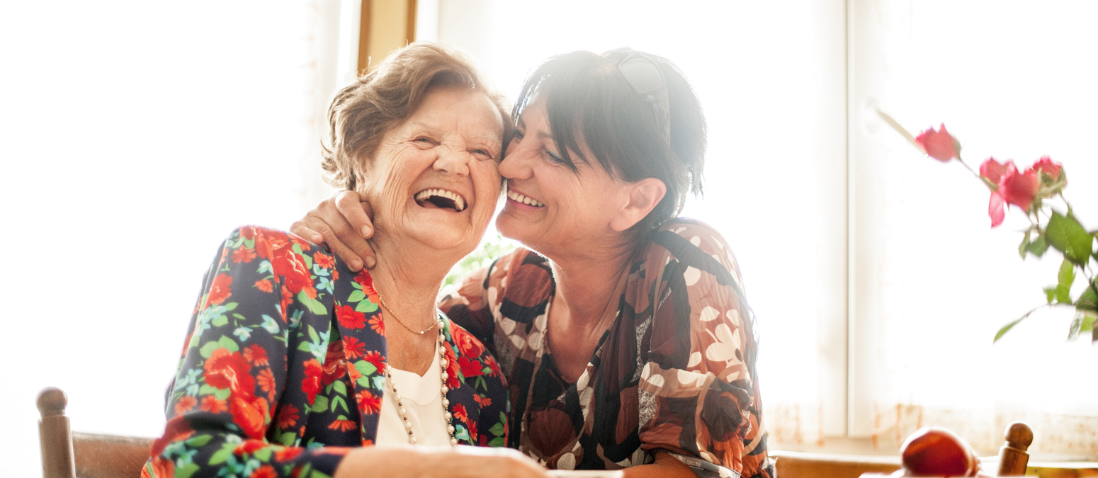 mother and daughter smiling